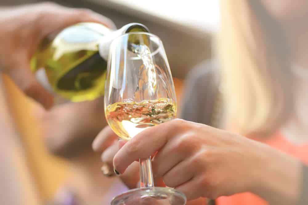 Sip and Swirl Through Great Wisconsin Wineries This Summer 1 Couple enjoying Wine tasting in Wisconsin at Cedar Creek Winery
