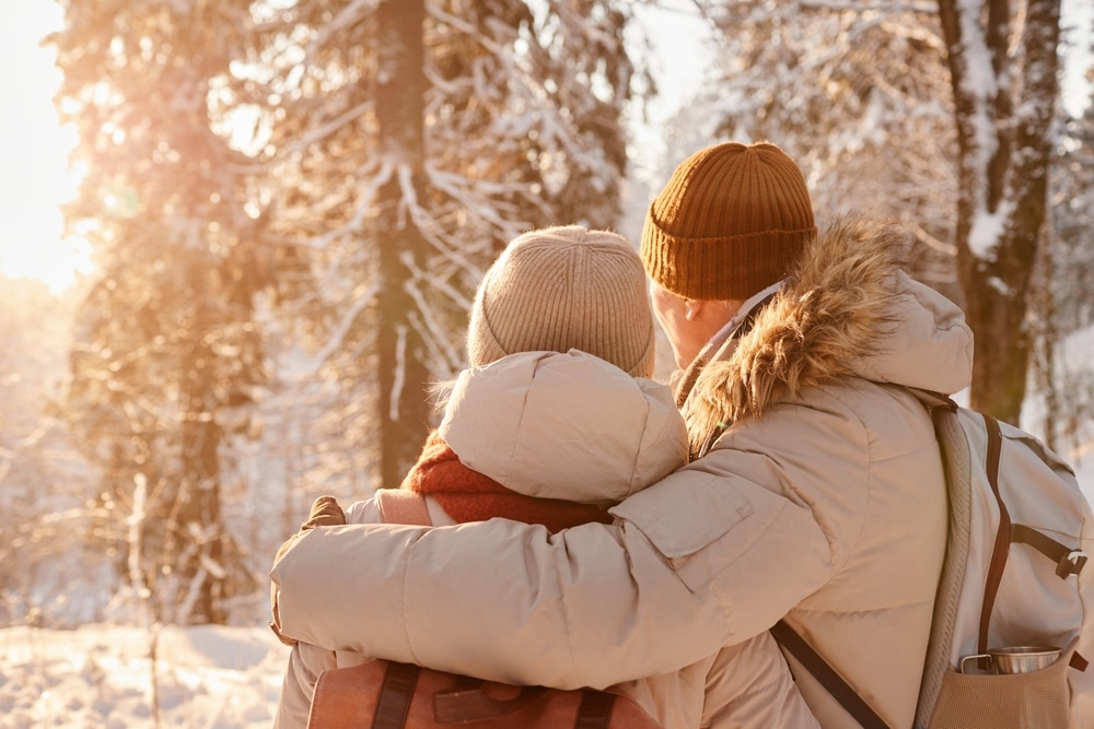 Back view of a couple enjoying the winter wonderland near us during their Wisconsin Winter Getaway
