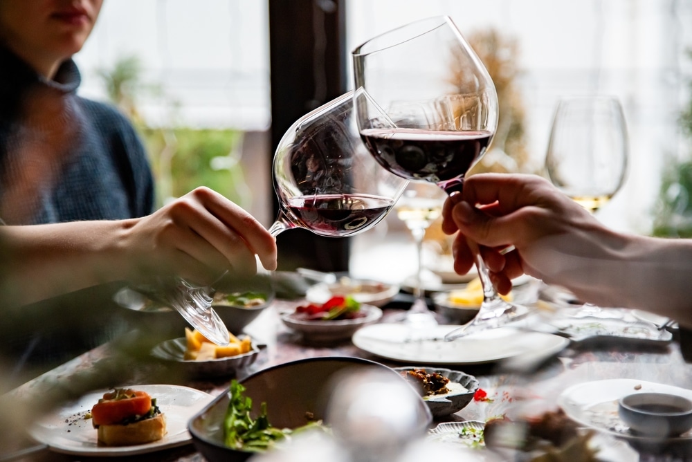 A couple enjoying wine and a dinner out at one of the top Restaurants in Cedarburg