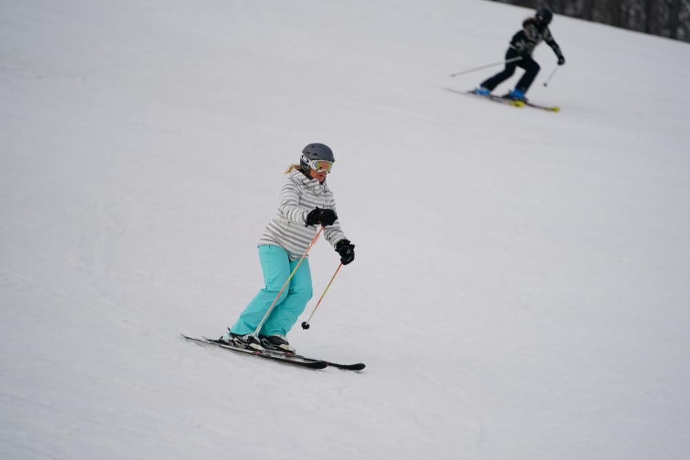 Woman skiing at Wisconsin ski hills like Little Switzerland Ski Area
